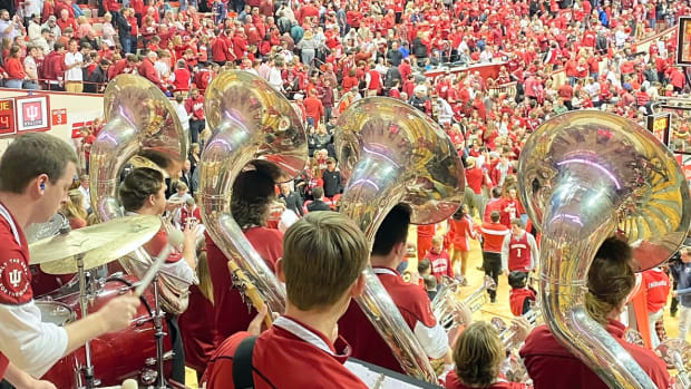 The Indiana University Pep Band continued playing the fight song after the Hoosiers' win over Purdue as students stormed the court to celebrate Indiana's victory.